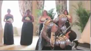 Groom sword fights knight at fantasy wedding