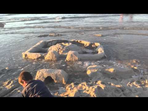 Huge Sand Castle vs waves: Time Lapse