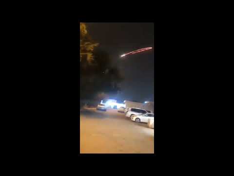 US Embassy C-Ram engaging rocket in Baghdad, explosion can be seen in background