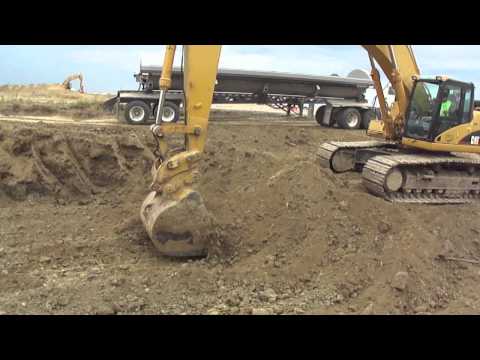 Caterpillar 345CL Excavating and Loading SideDumps on a Earth Moving Project In Troy, IL.