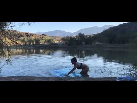 Artist Sara S'Jegers processing a cyanotype in the Rio Grande in Big Bend