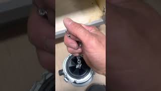 Installing a garbage disposal using a    Dr. Disposal Garbage disposal installer.