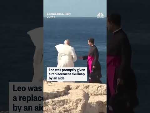 Pope Leo's skullcap was swept away by strong winds during a visit to Lampedusa