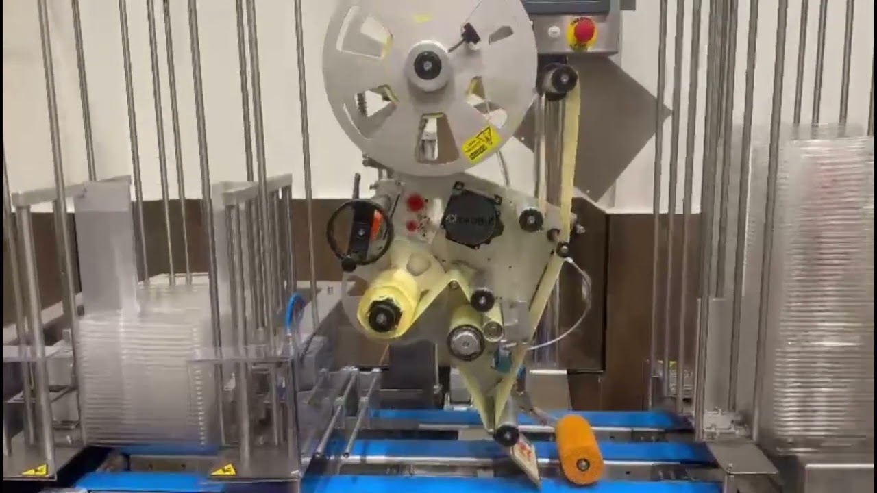Labeling Machine with Integrated Denesting and Collection System by TADBIK