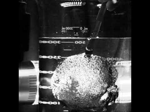 Popping a Balloon Underwater at 30,000 FPS