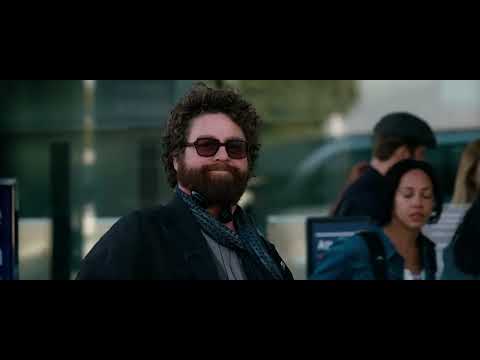 Trailer frame: two leads arguing in the car; needle-drop keeps the scene rolling