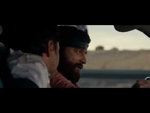 Due Date official trailer still: Downey Jr. and Galifianakis on the road, comedic tension set to classic-rock and indie cues