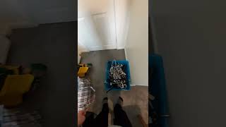 dropping coat hangers into a box