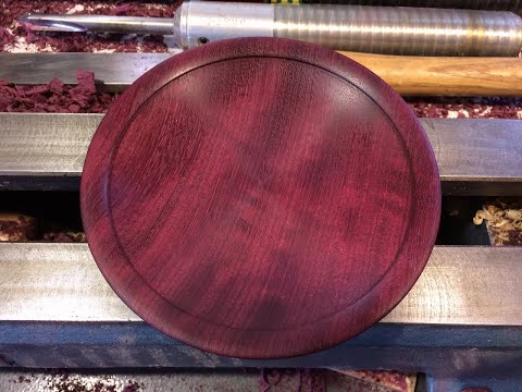 Richard Raffan turns a plate from quilted purpleheart