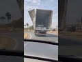 Flagrante de Caminhão baú transitando com porta aberta no anel viário, em Aparecida de Goiânia.