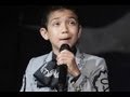 Boy Wearing Mexican Sings America National.