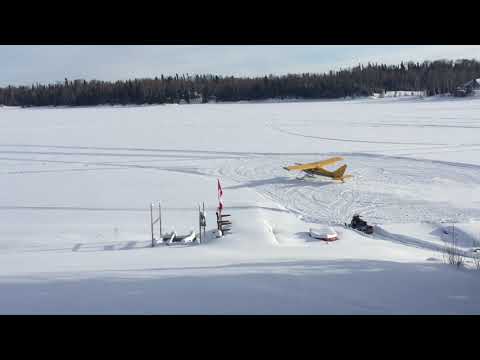 Glasair Sportsman on skis taking off