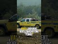 Firefighters burn unspent brush with drip torches to widen containment lines against wildfires.