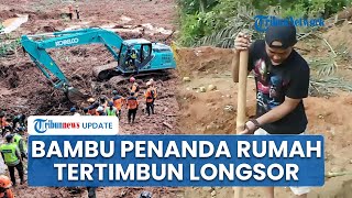 Bantu Pencarian Korban, Warga Majenang Pasang Bambu Penanda Lokasi Rumah yang Tertimbun Longsor