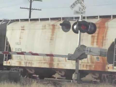 Awesomely Slow moving grain train with nice power and an awesome hornshow
