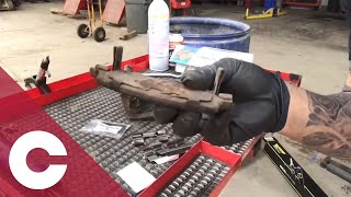 Cleaning Caliper Brackets by Five Star Automotive Specialists
