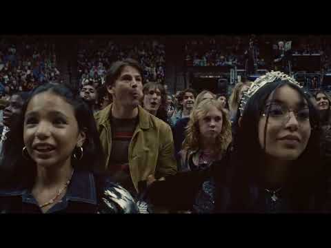 Trap trailer end card with floodlit stage and title reveal as crowd roars