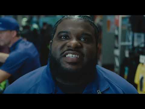 Trap official trailer thumbnail with concert crowd and crimson lighting framing the thriller setup