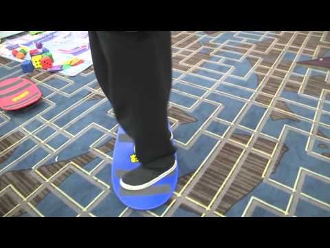 Stewart Demonstrates the Penguin Walk Using a Spooner Board and a Spikeball Ball