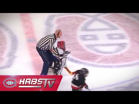 Young hockey player gets a lift from the referee