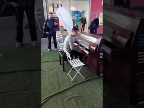 Matthew Lee plays the piano at the Shopping Village...