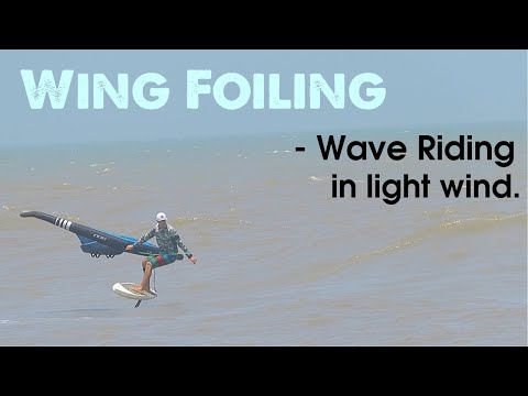 WING FOILING : Riding Waves in light side on shore wind.