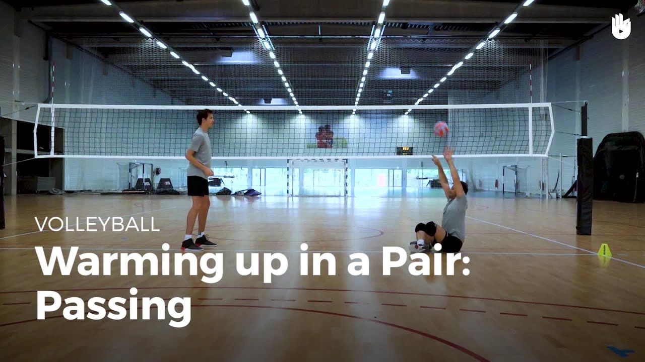 Warming up in a pair passing Learn to Play Volleyball Sikana