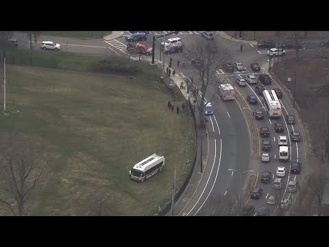 MBTA bus crashes through cemetery fence after colliding with car