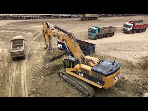 Caterpillar 385C Excavator Loading Trucks - Kivos Ate