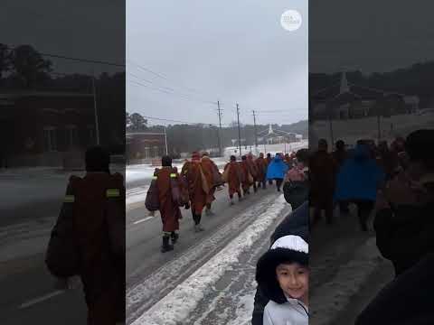 Buddhist monks continue 'Walk for Peace' despite winter storm
