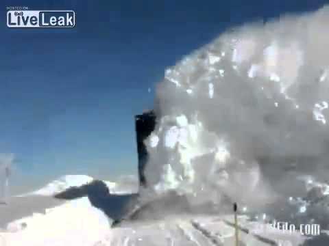 Russian train ploughs through snow.