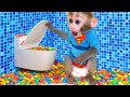 Monkey Baby Bon Bon meets rain of chocolate candy and eats rainbow milk bottle jelly with ducks