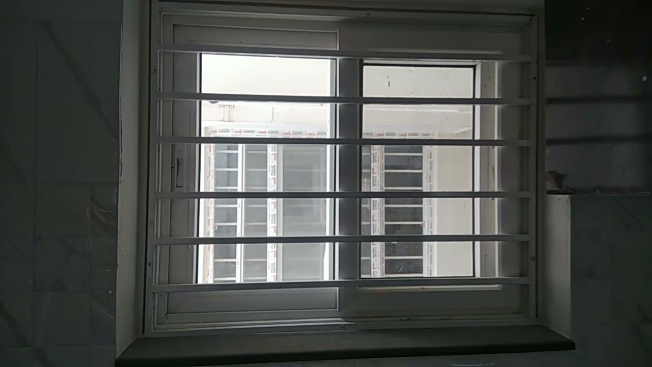 Watch video Upvc Sliding Windows with Iron Grill and Mosquito Mesh | 2BHK Flat | MWindows Now Upvc Sliding Windows with Iron Grill and Mosquito Mesh | 2BHK Flat | MWindows