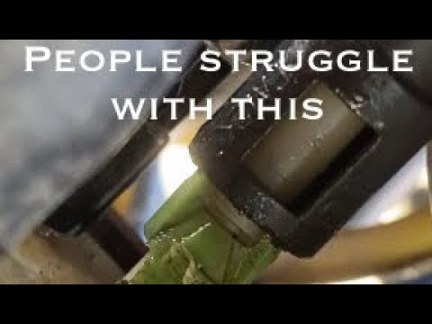Removing fuel line on Honda rancher Green clip removal