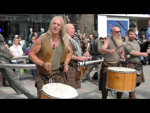 Wild men of Scottish street music Clanadonia playing Spanish Eyes in Perth City Centre Scotland
