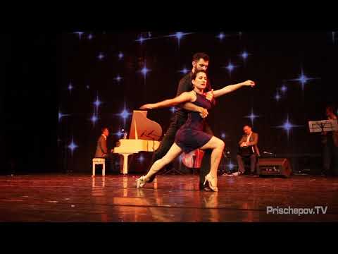  Dana Frigoli  and  Adrian Ferreyra  are  dancing  to  a  nontraditional song  at  Planetango Moscow  in  2018