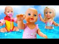 Baby Annabell doll & kids pretend play baby dolls at the beach.  Baby doll morning routine & toys