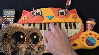 LUCAS THE SPIDER: GIANT SPIDER ON A CAT PIANO AND A DRUM CALCULATOR