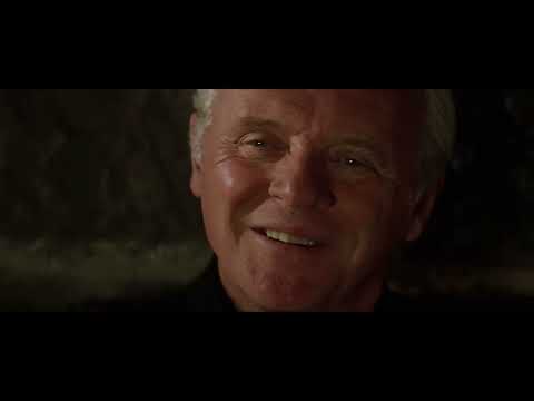 Trailer montage with slow-motion bike joust and desert sand — the 'Bare Island' climax sound in images