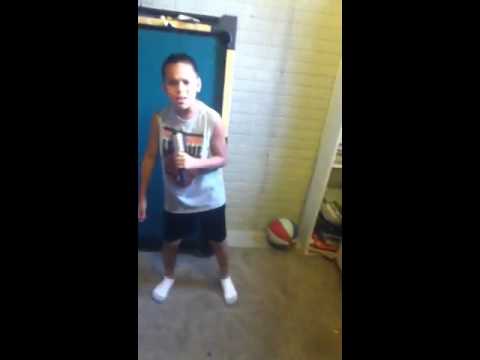 8 year old boy singing grenade by bruno mars