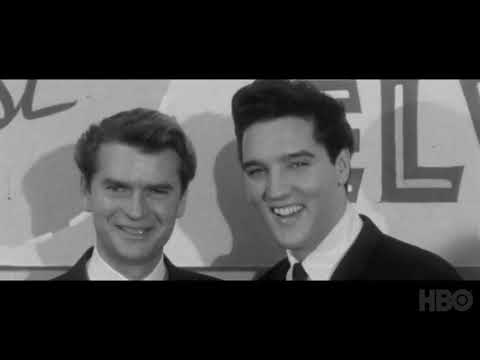 Trailer frame: Sun-era studio photos dissolving into 1968 black-leather rehearsal imagery