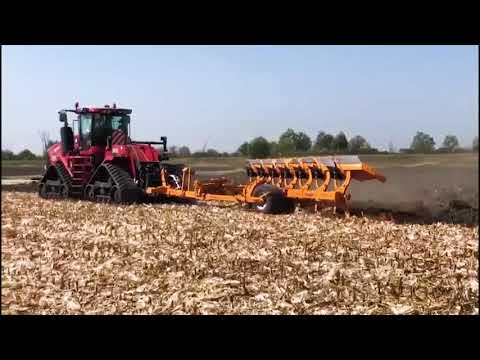 Big Tractors plowing