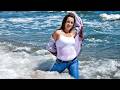 WET JEANS CUTE GIRL BOLDLY RUN INTO THE SEA WITH HER CLOTHES ON GETTING WET AND THEN POSE GREATLY