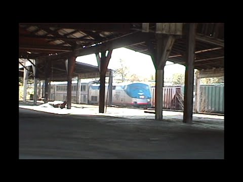 1247. AMTRAK # 27 from INSIDE STEVENSON Mill with 2 mail box cars on rear and with 1 passenger engin