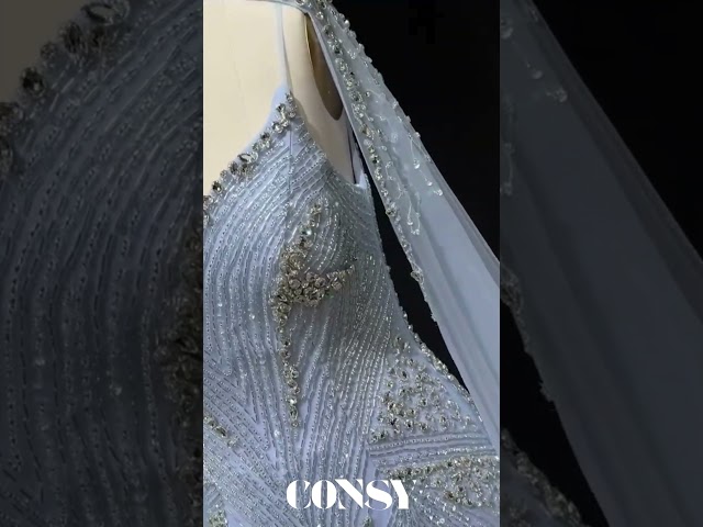 فستان سهرة حورية البحر الملكي بتطريز كريستالي وأكمام كيب