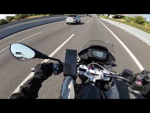 On the highway towards Sitges in Spain for a day trip on BMW 310GS in August 2024