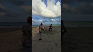 Double sword fight training on the beach ⛱️ We have to wear helmets 🪖