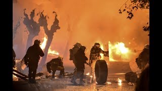 Athens Riot: Police throws asphyxiating gas inside an apartment building and kicks a kid in the head