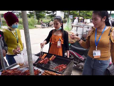 Foods And People Activities In Front Of Garment Factory