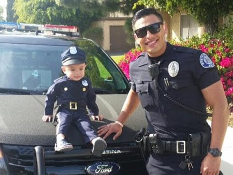 'Hot cop' posing with a cute uniform-clad boy becomes an internet heartthrob